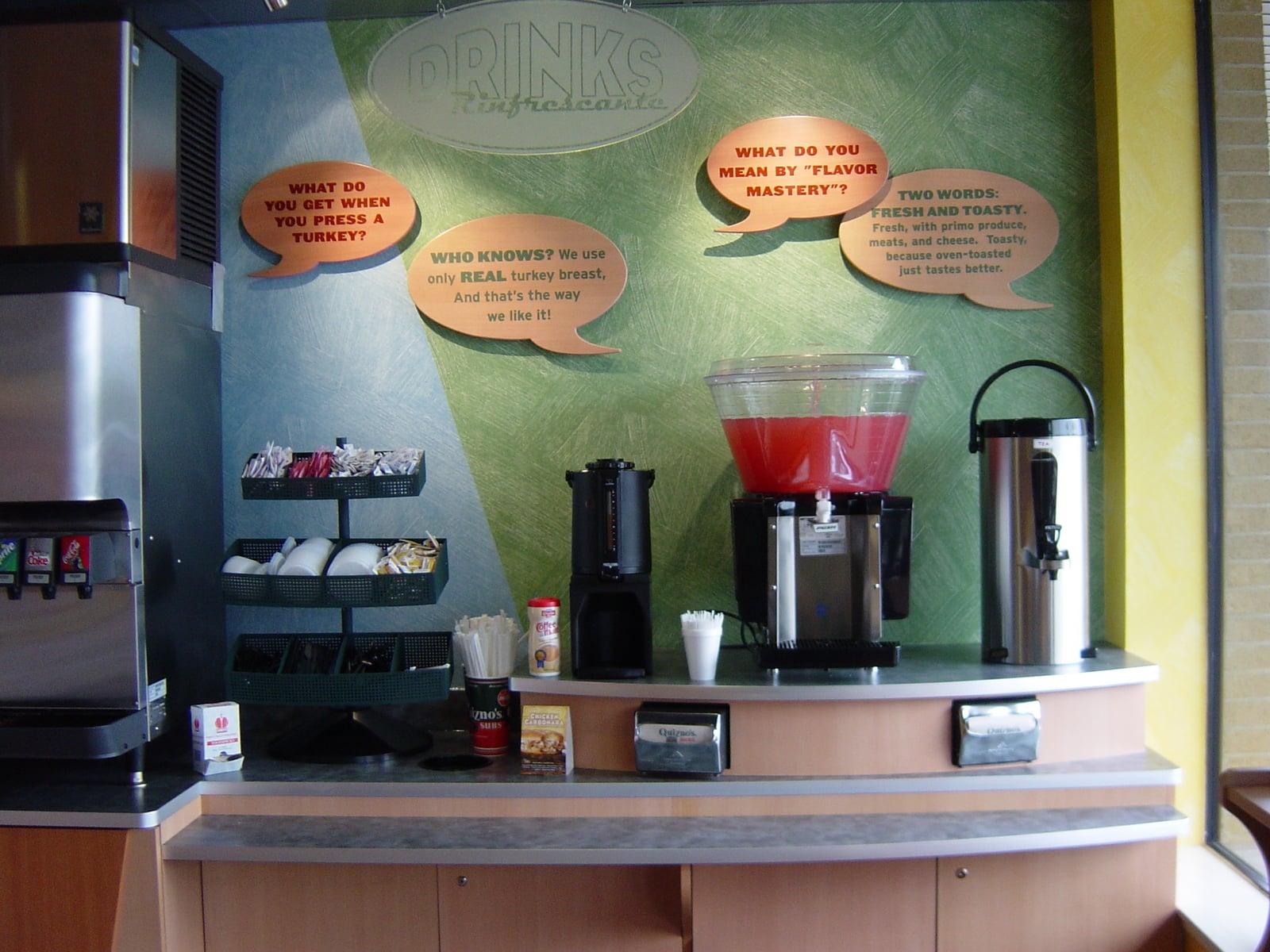 Gibson Design Group Inc. commercial counter installation with beverage station, drink dispensers, and modern wall design in Grosse Pointe, MI.